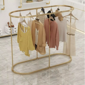 Portant vêtement doré rond style boutique